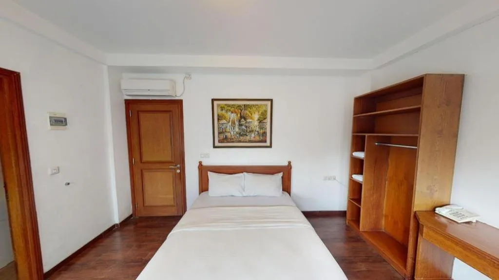 Bed in Hotel Amira Pasteur