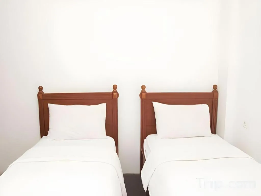 Bed in Hotel Amira Pasteur