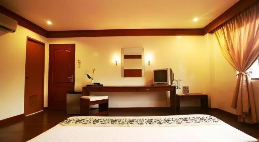 Bed in Naga Land Hotel