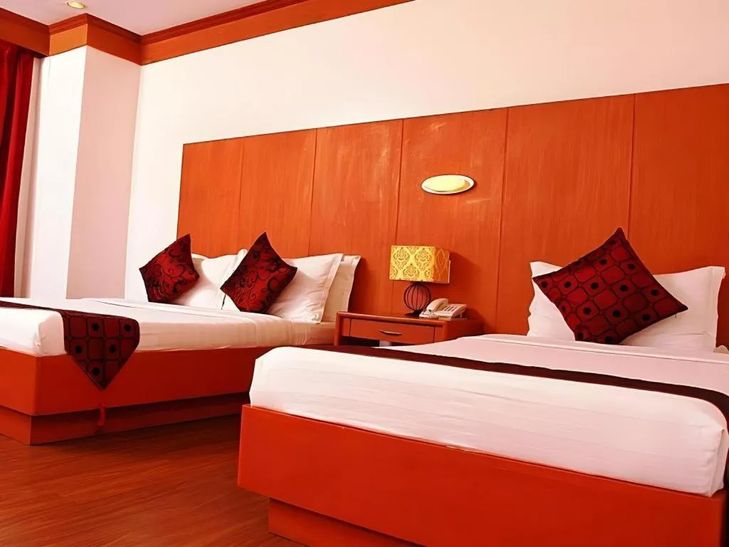 Bed in Naga Land Hotel