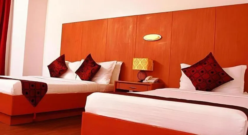 Bed in Naga Land Hotel