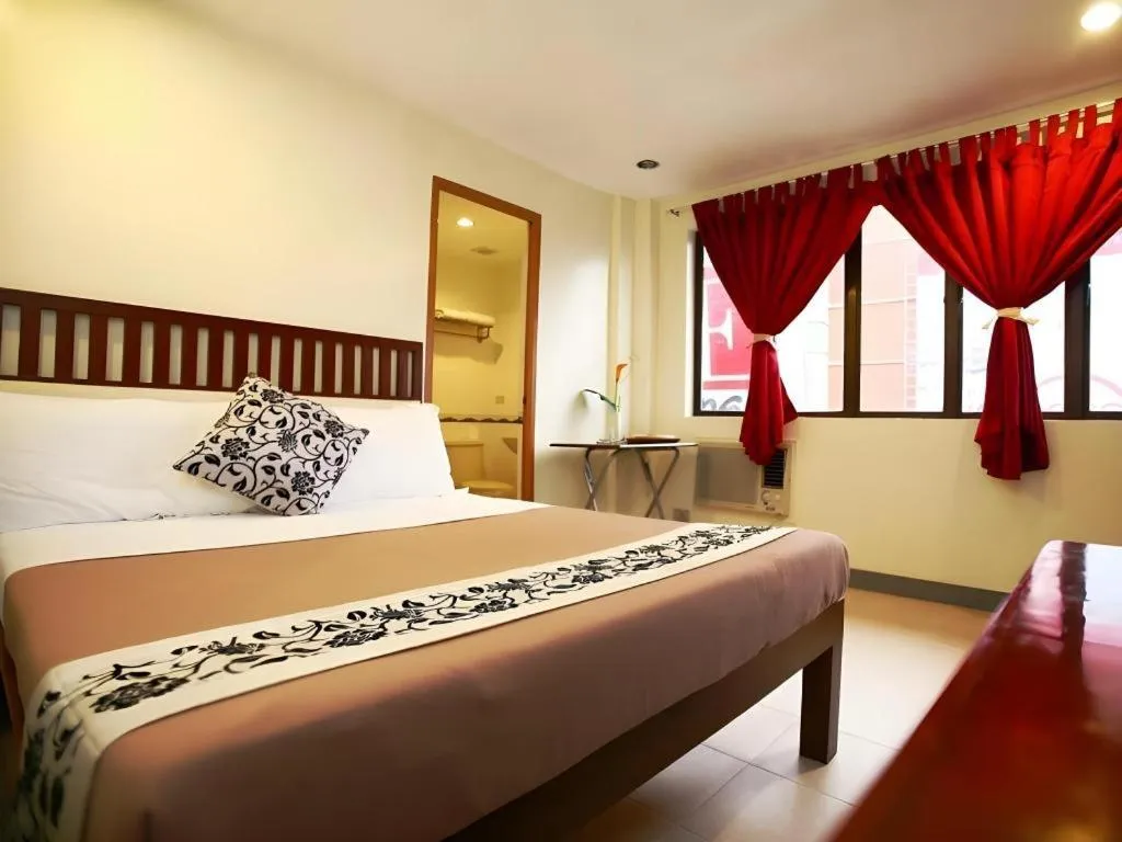 Bed in Naga Land Hotel