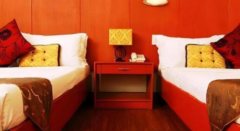 Bed in Naga Land Hotel