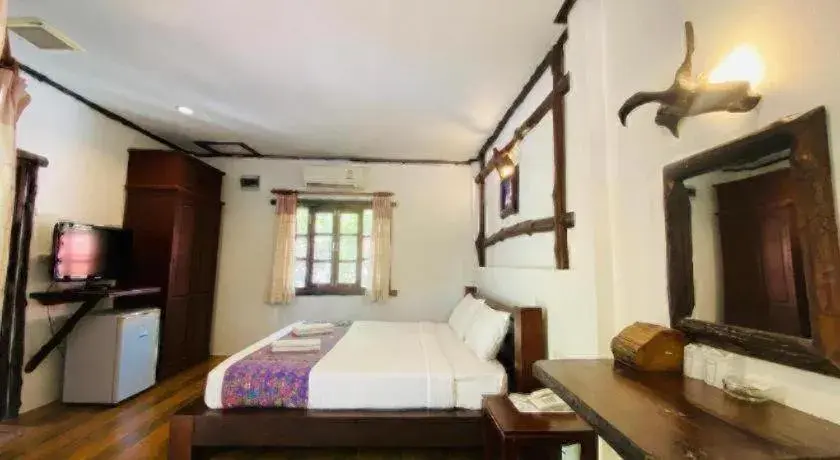 Bed in Alongkot Beach Resort Khanom Bed in Alongkot Beach Resort Khanom