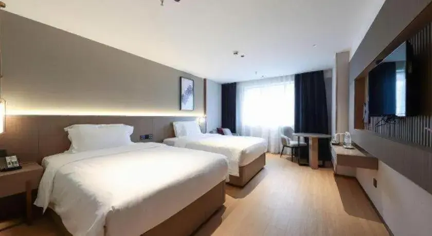 Bed in Lavande Hotels Guangzhou Fangcun Huadiwan Metro Station Bed in Lavande Hotels Guangzhou Fangcun Huadiwan Metro Station