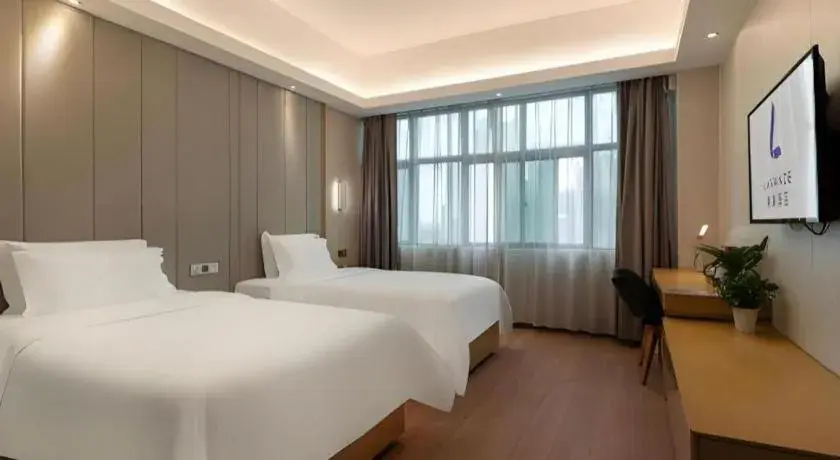 Bed in Lavande Hotels Guangzhou Fangcun Huadiwan Metro Station Bed in Lavande Hotels Guangzhou Fangcun Huadiwan Metro Station