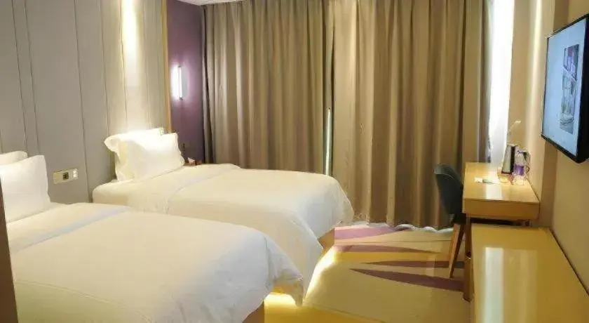 Bed in Lavande Hotels Guangzhou Fangcun Huadiwan Metro Station Bed in Lavande Hotels Guangzhou Fangcun Huadiwan Metro Station