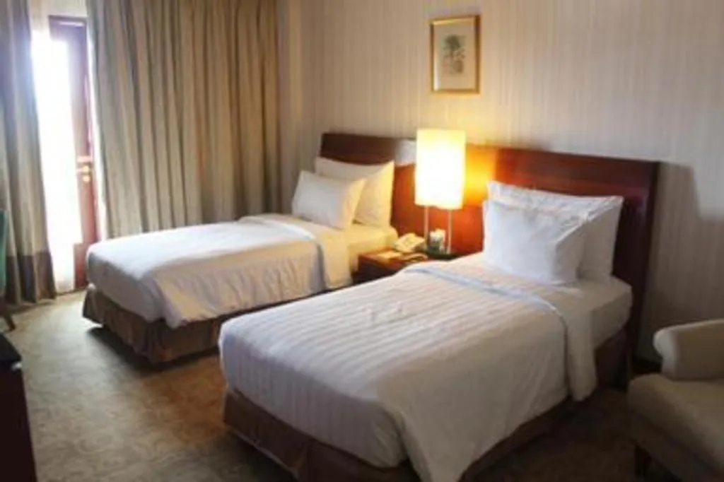 Bed in Labersa Grand Hotel &Convention Center