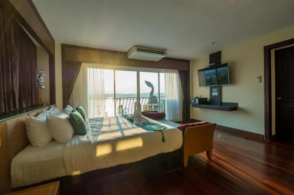 Bed in LANDMARK NAKHONPHANOM HOTEL