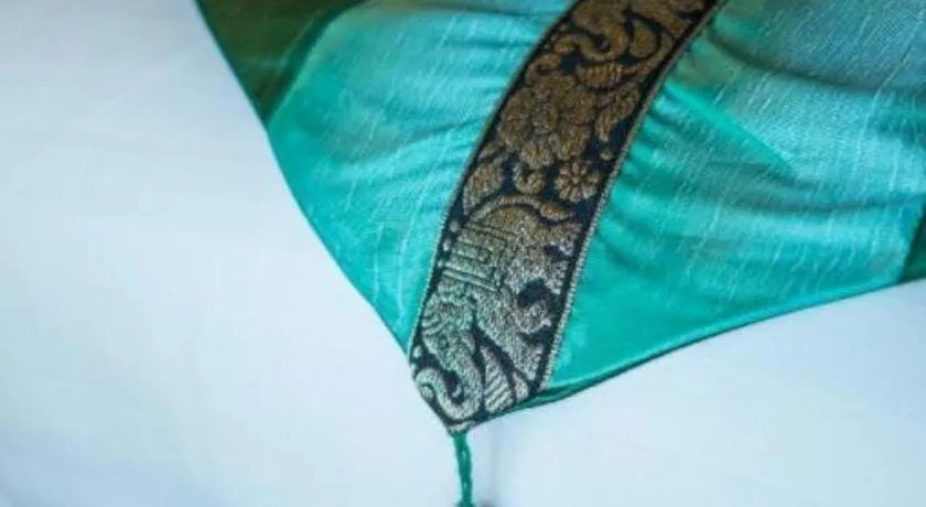 Bed in LANDMARK NAKHONPHANOM HOTEL