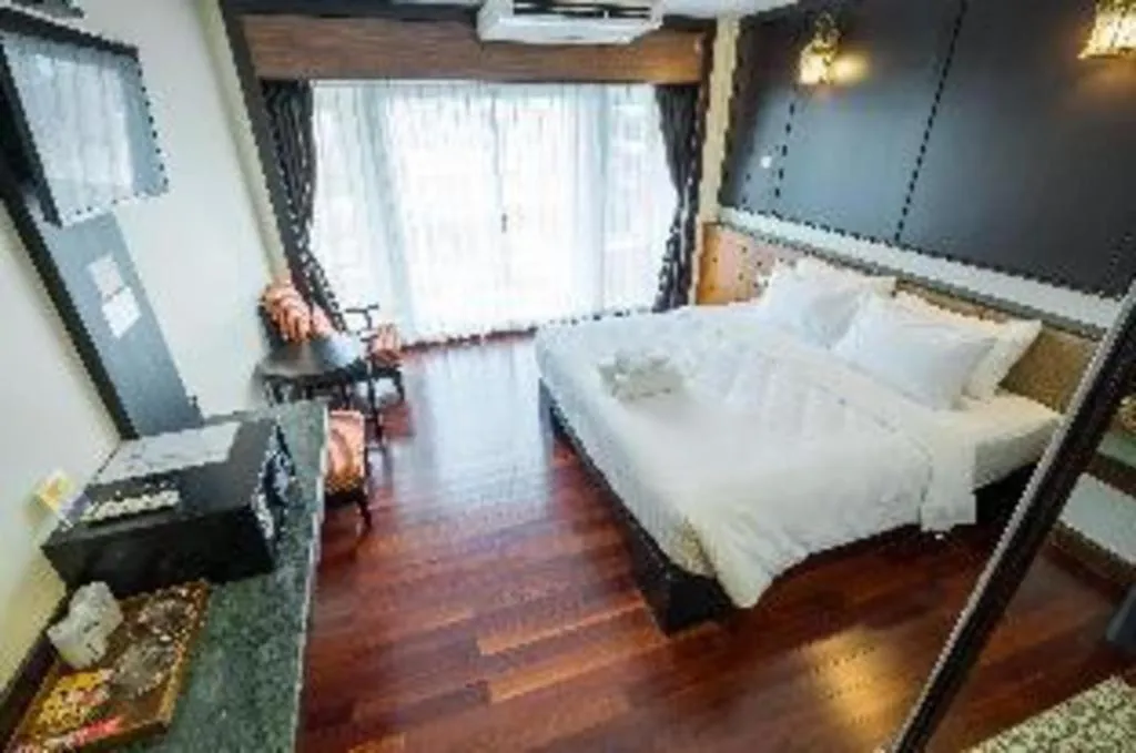 Bed in LANDMARK NAKHONPHANOM HOTEL