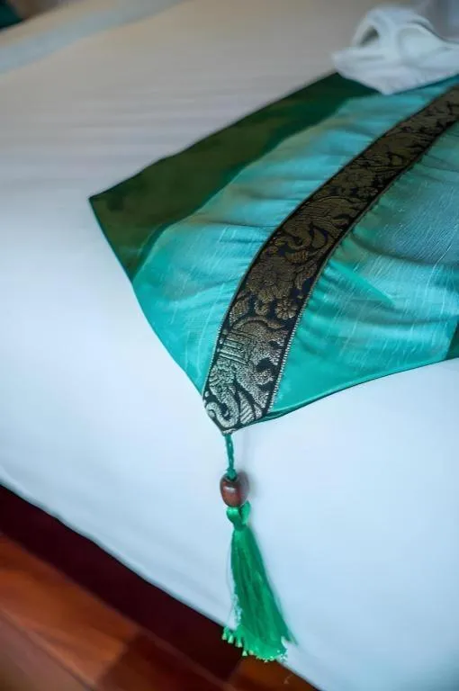 Bed in LANDMARK NAKHONPHANOM HOTEL