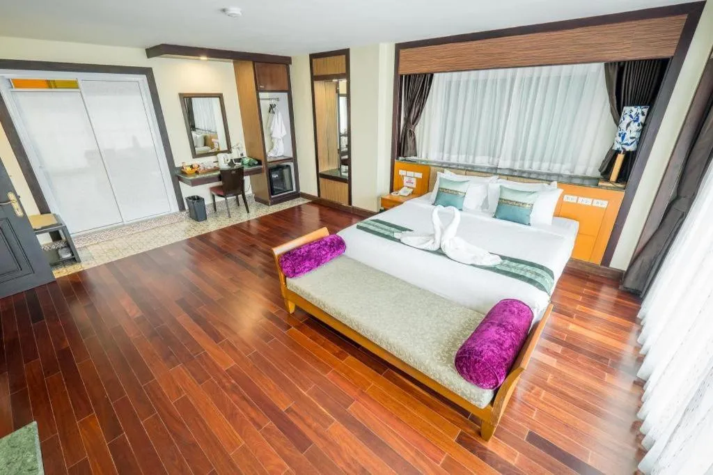 Bed in LANDMARK NAKHONPHANOM HOTEL