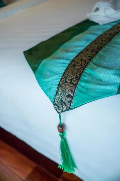 Bed in LANDMARK NAKHONPHANOM HOTEL