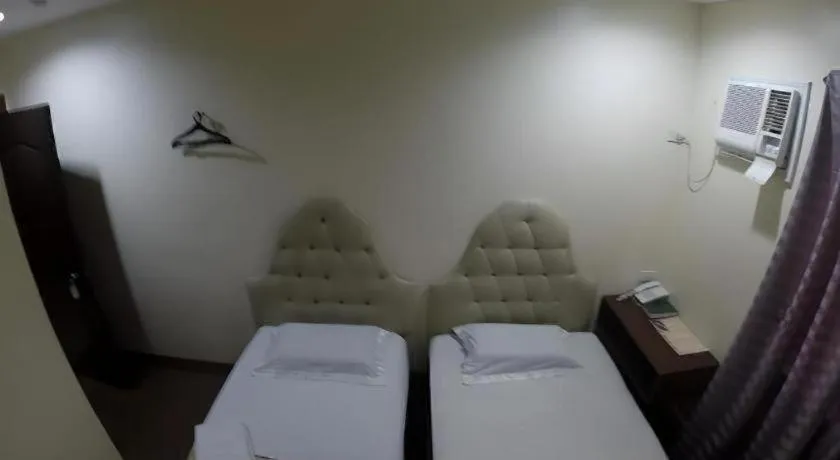 Bed in Rich Manor Pension House