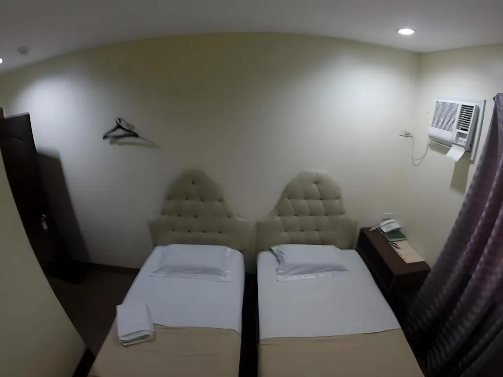 Bed in Rich Manor Pension House