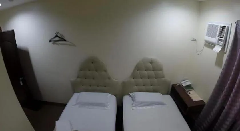 Bed in Rich Manor Pension House