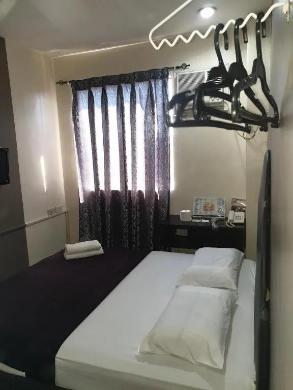 Bed in Rich Manor Pension House