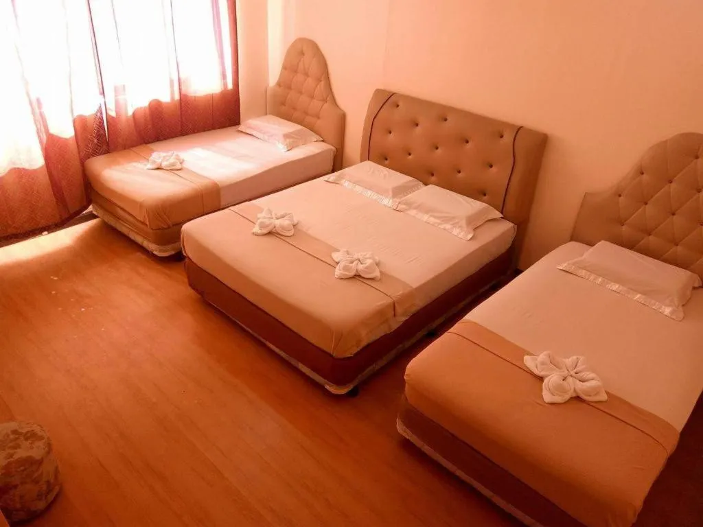 Bed in Rich Manor Pension House