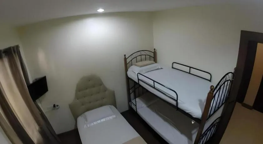 Bed in Rich Manor Pension House