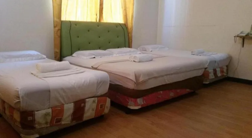 Bed in Rich Manor Pension House