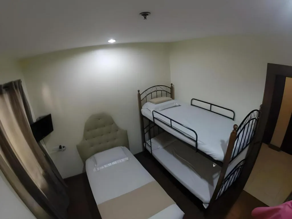 Bed in Rich Manor Pension House