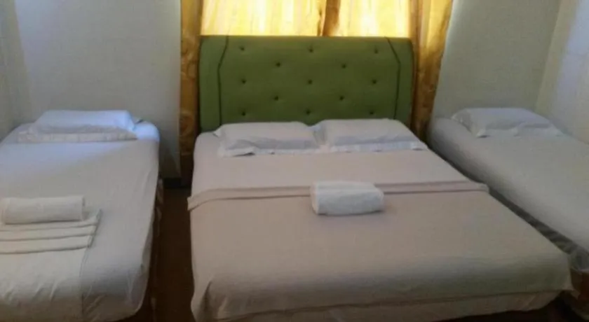 Bed in Rich Manor Pension House