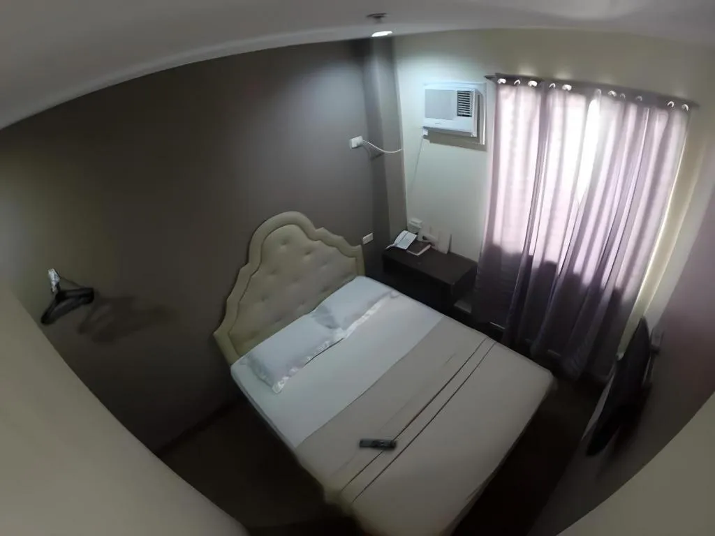 Bed in Rich Manor Pension House