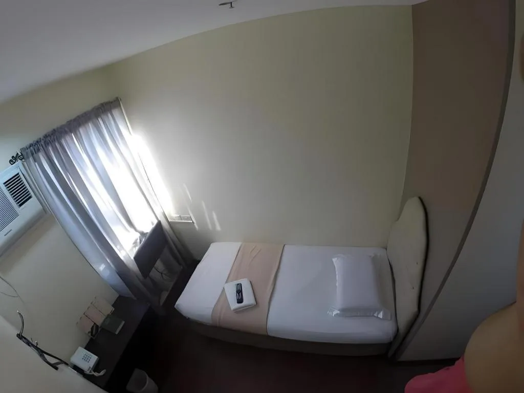 Bed in Rich Manor Pension House