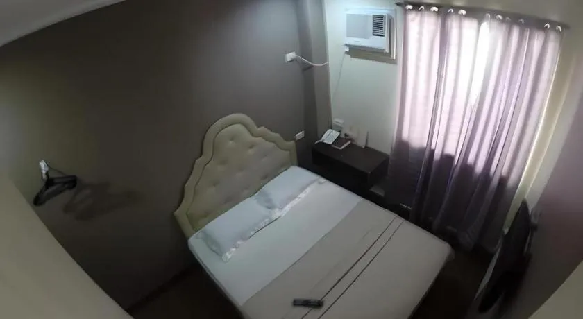 Bed in Rich Manor Pension House