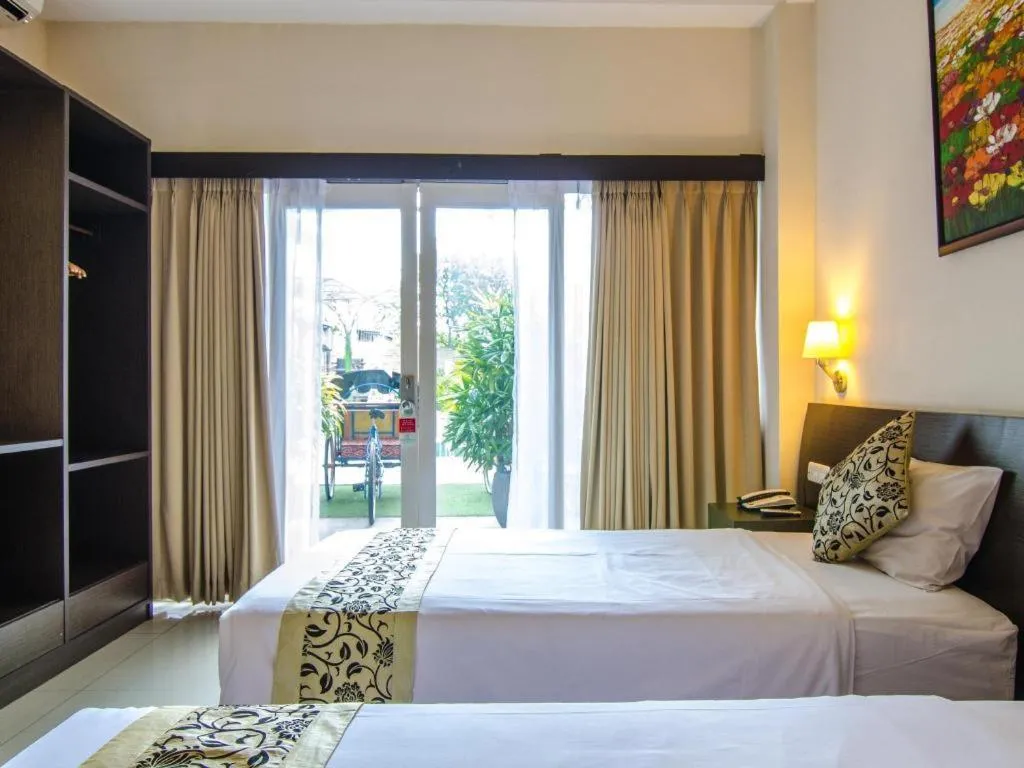 Bed in Losari Sunset Hotel