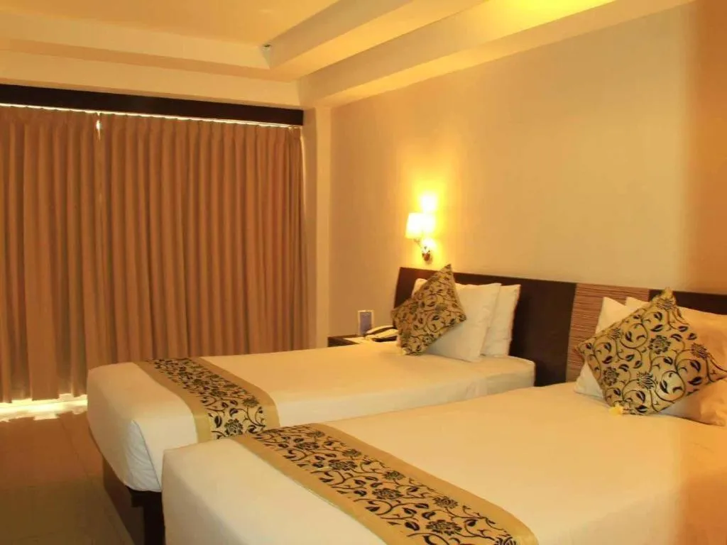 Bed in Losari Sunset Hotel