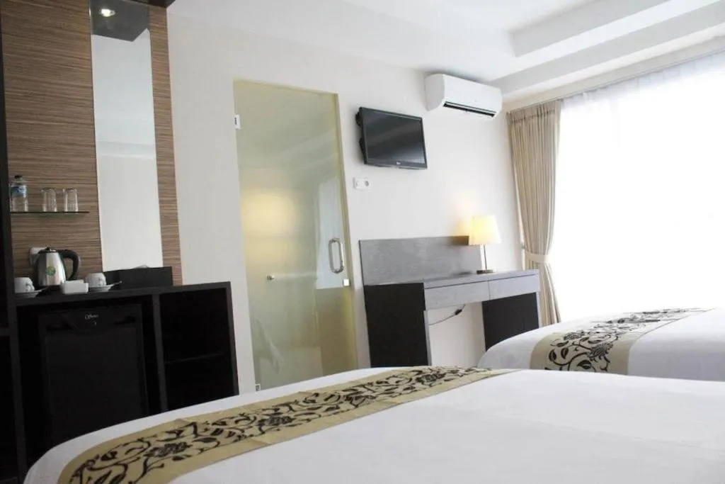Bed in Losari Sunset Hotel