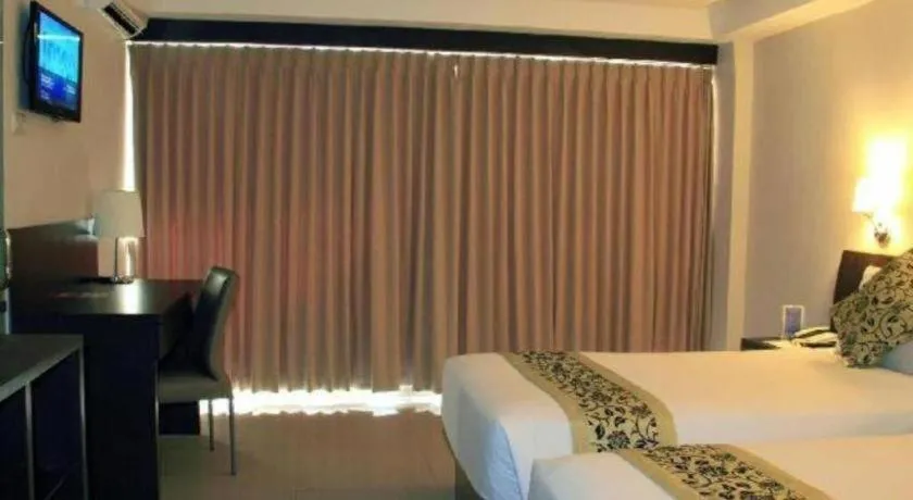 Bed in Losari Sunset Hotel