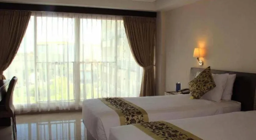 Bed in Losari Sunset Hotel