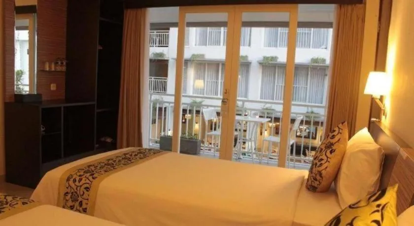 Bed in Losari Sunset Hotel