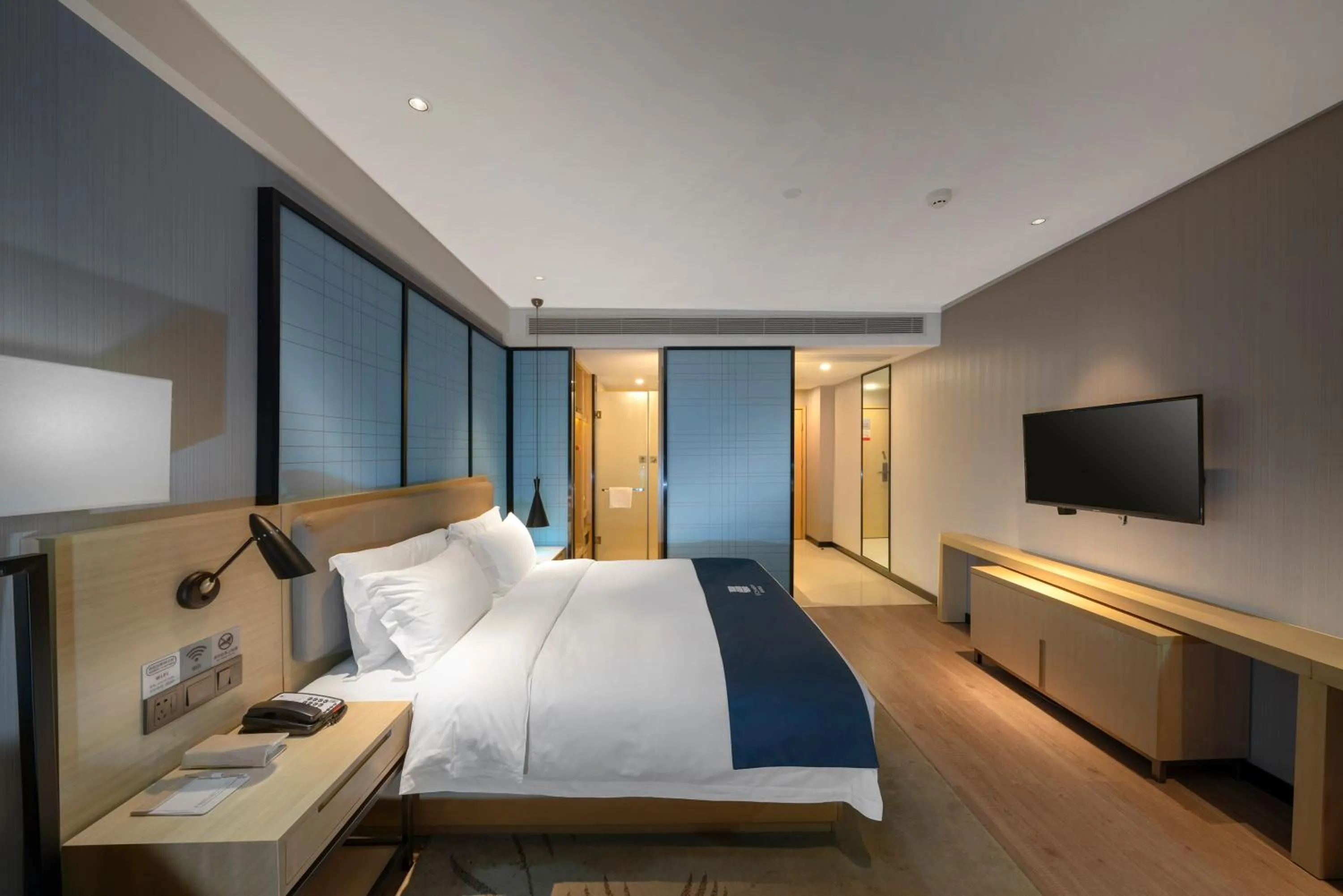 Bedroom, Bed in Echarm Hotel Haikou Zhongshan South Road East High Speed Railway Station