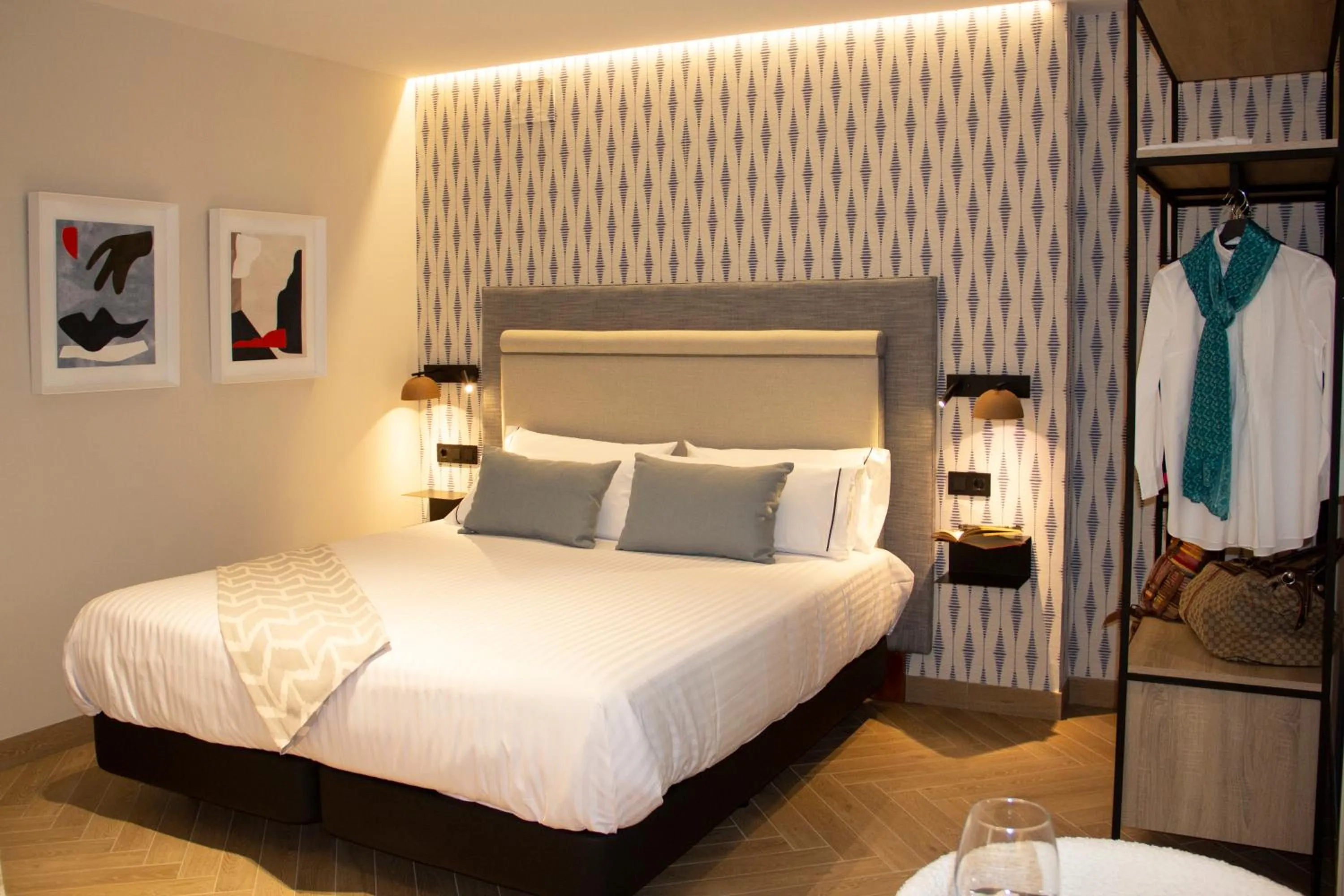 Bed in Puerta de la Ribera Suites