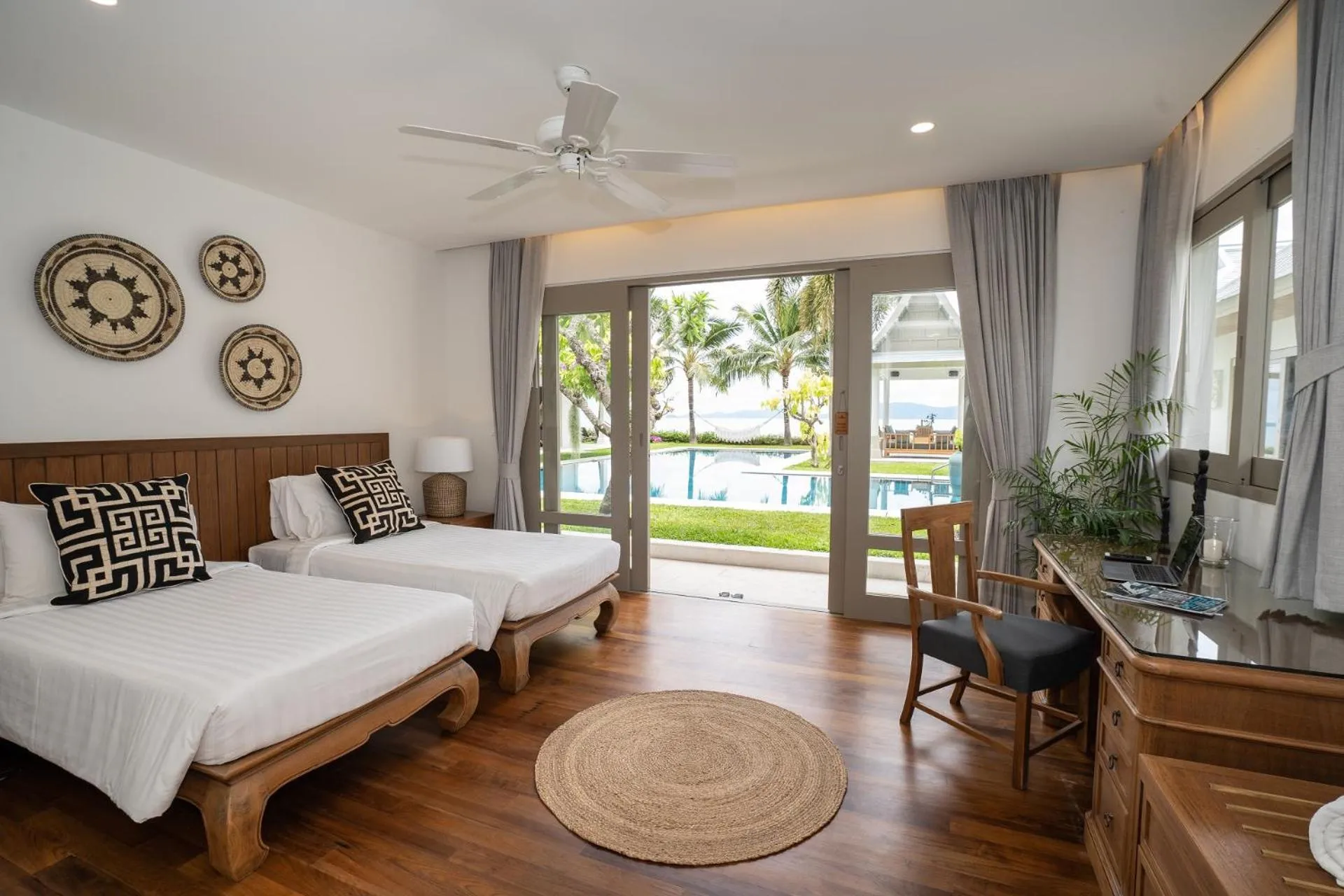 Bed in Miskawaan Beachfront Villas
