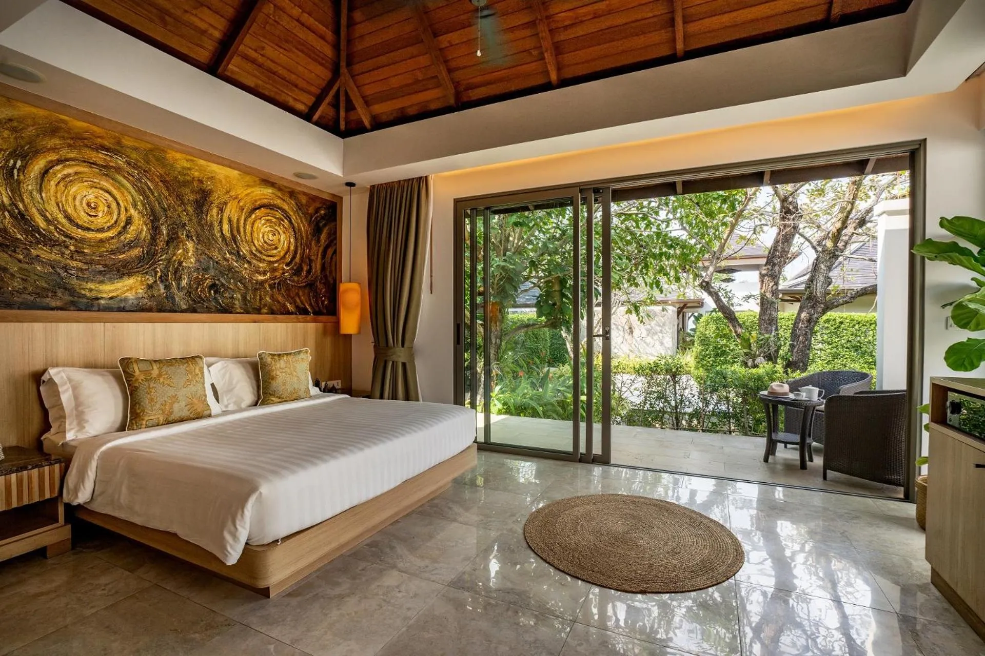 Bed in Miskawaan Beachfront Villas