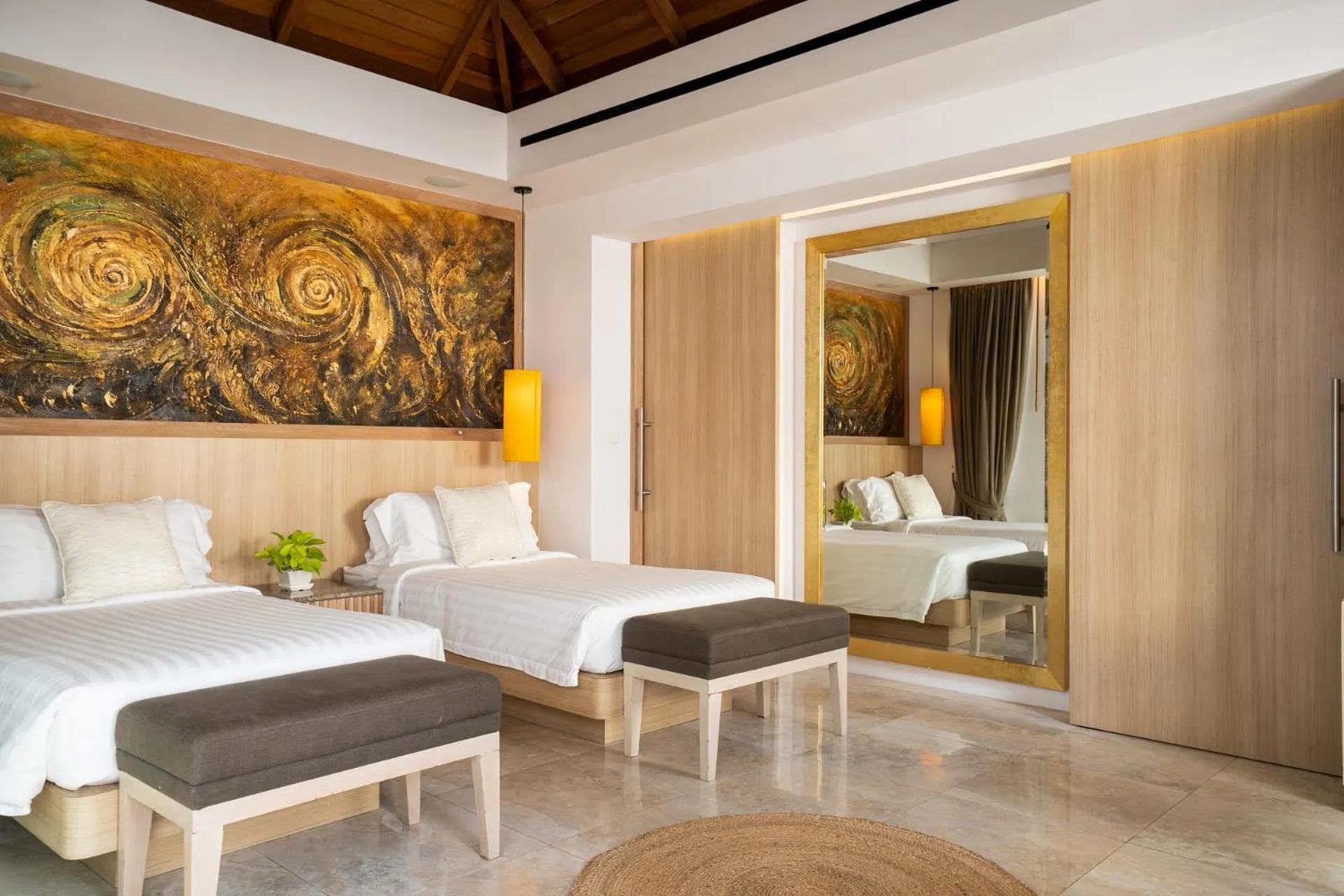 Bed in Miskawaan Beachfront Villas