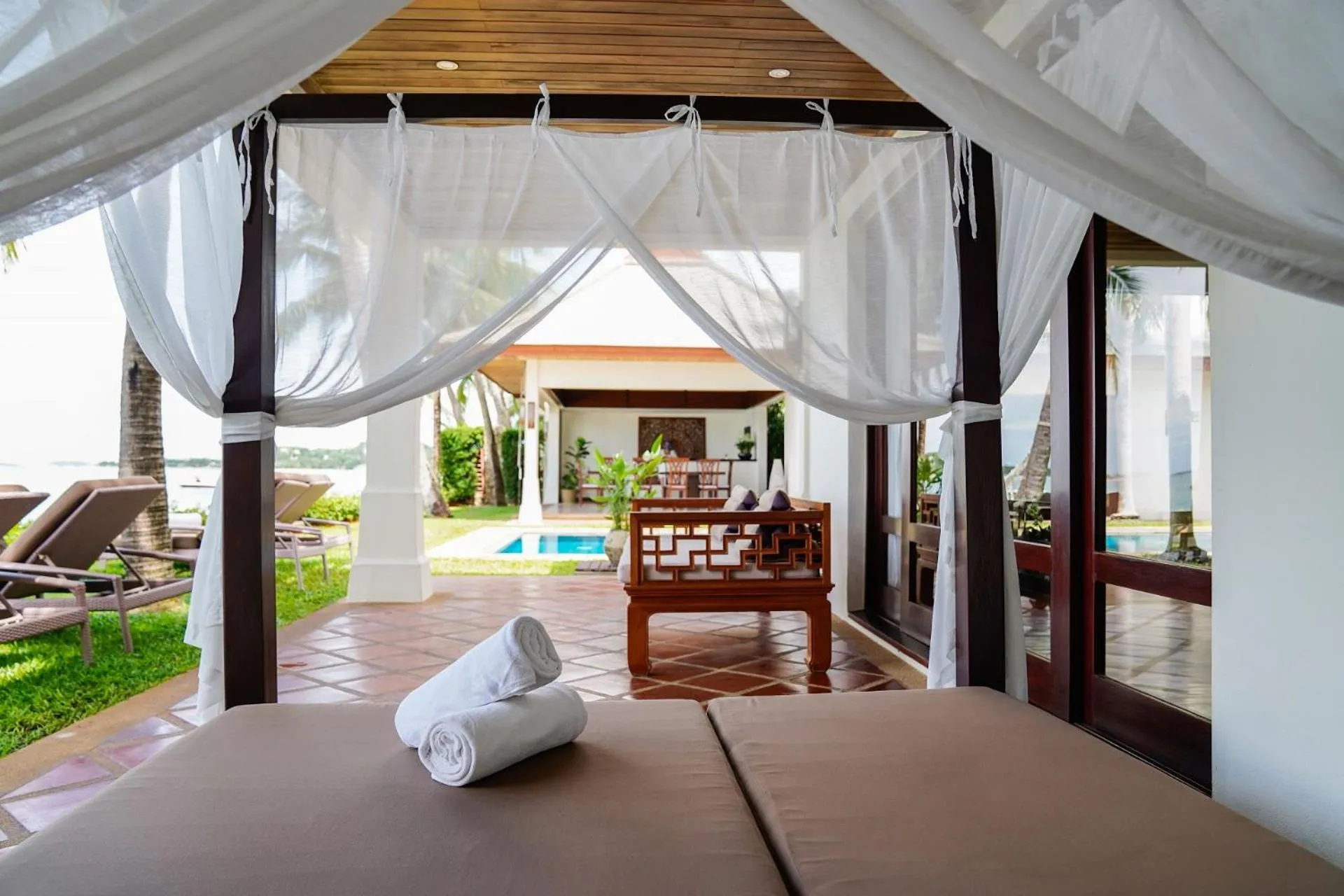 Bed in Miskawaan Beachfront Villas