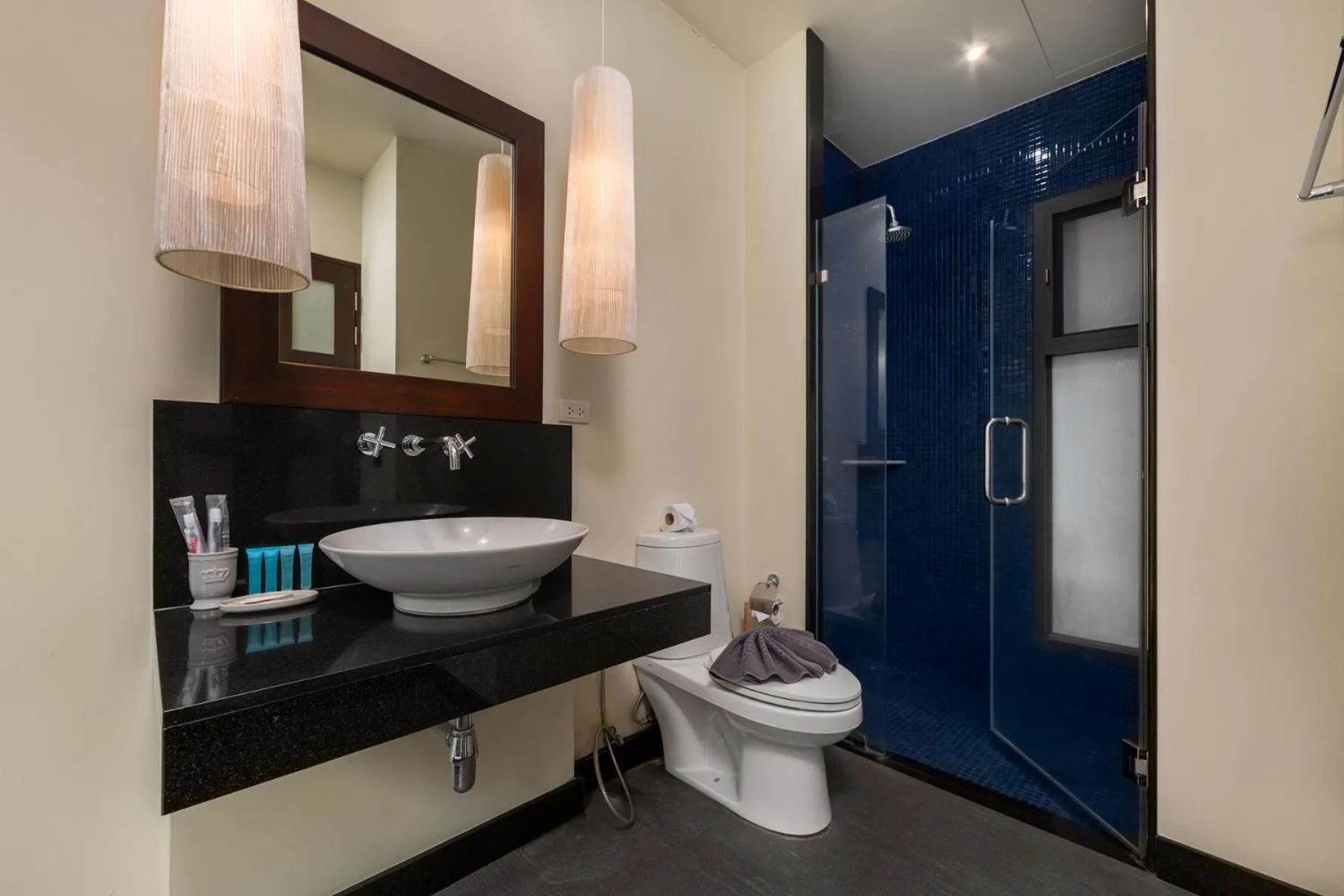 Bathroom in Saiyuan Estate by TropicLook