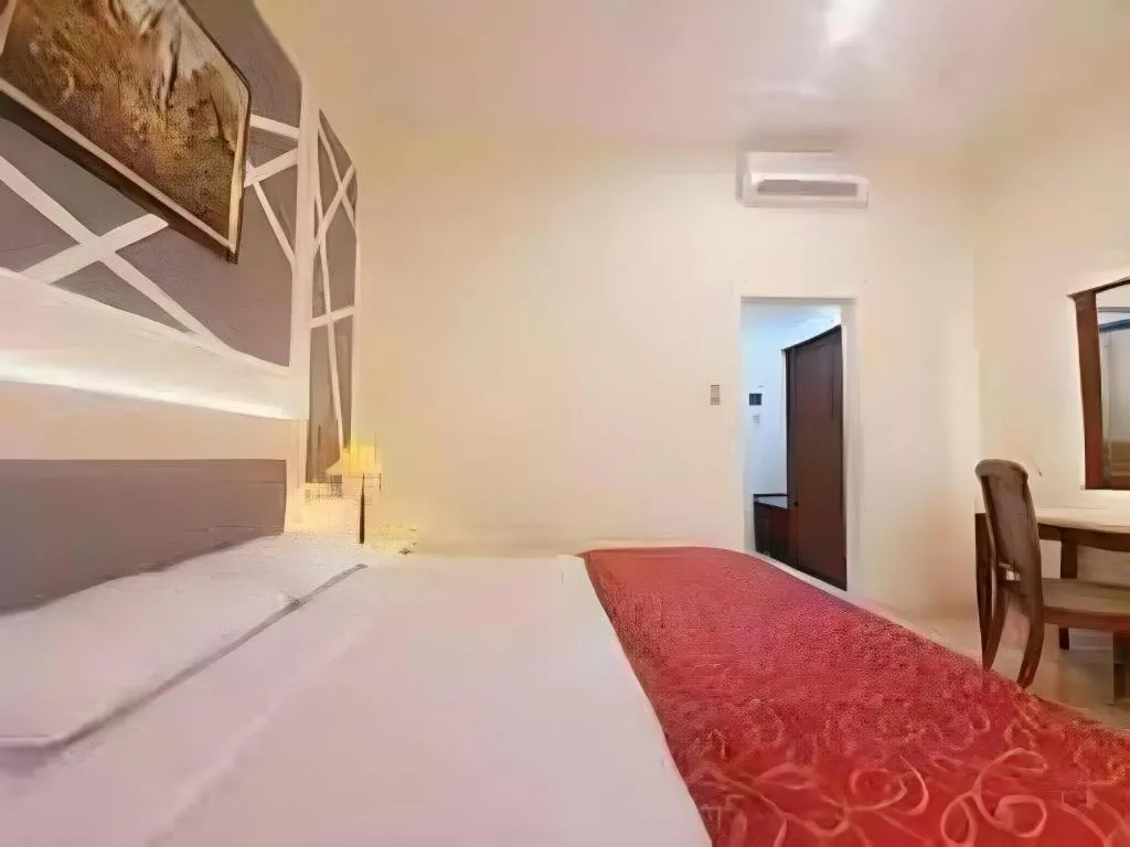 Bed in Larisae Setia Kawan Hotel