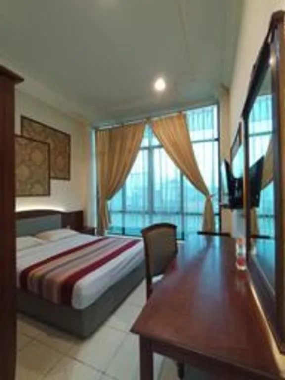 Bed in Larisae Setia Kawan Hotel