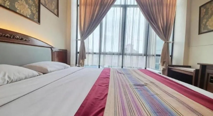 Bed in Larisae Setia Kawan Hotel