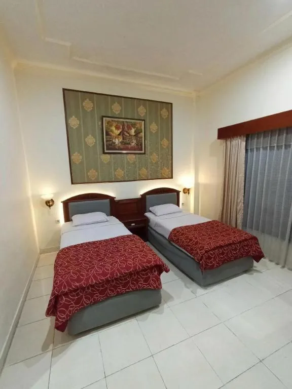Bed in Larisae Setia Kawan Hotel