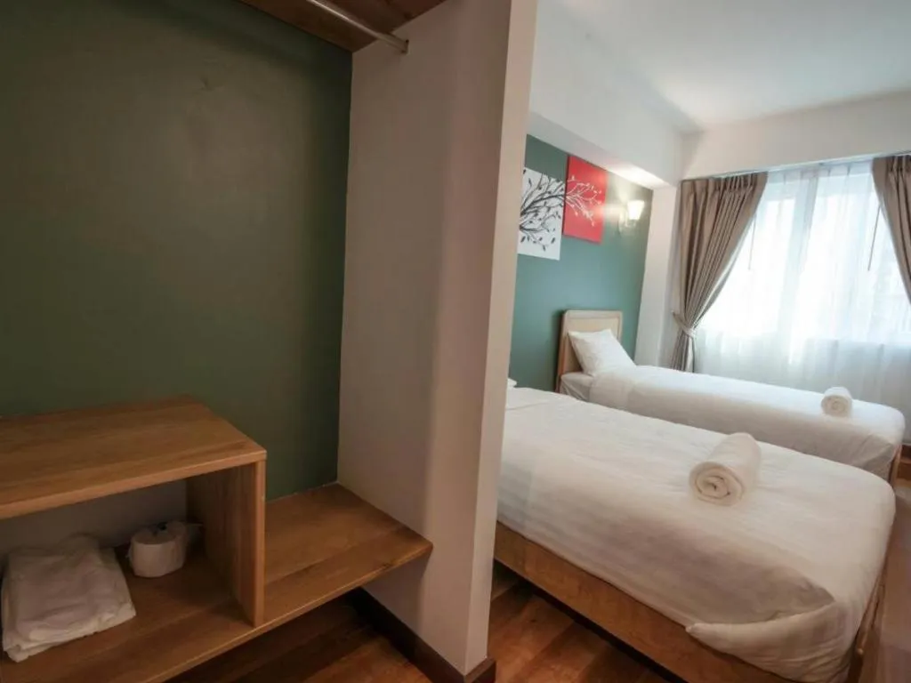 Bed in Cozy At 9 Hotel And Kitchen