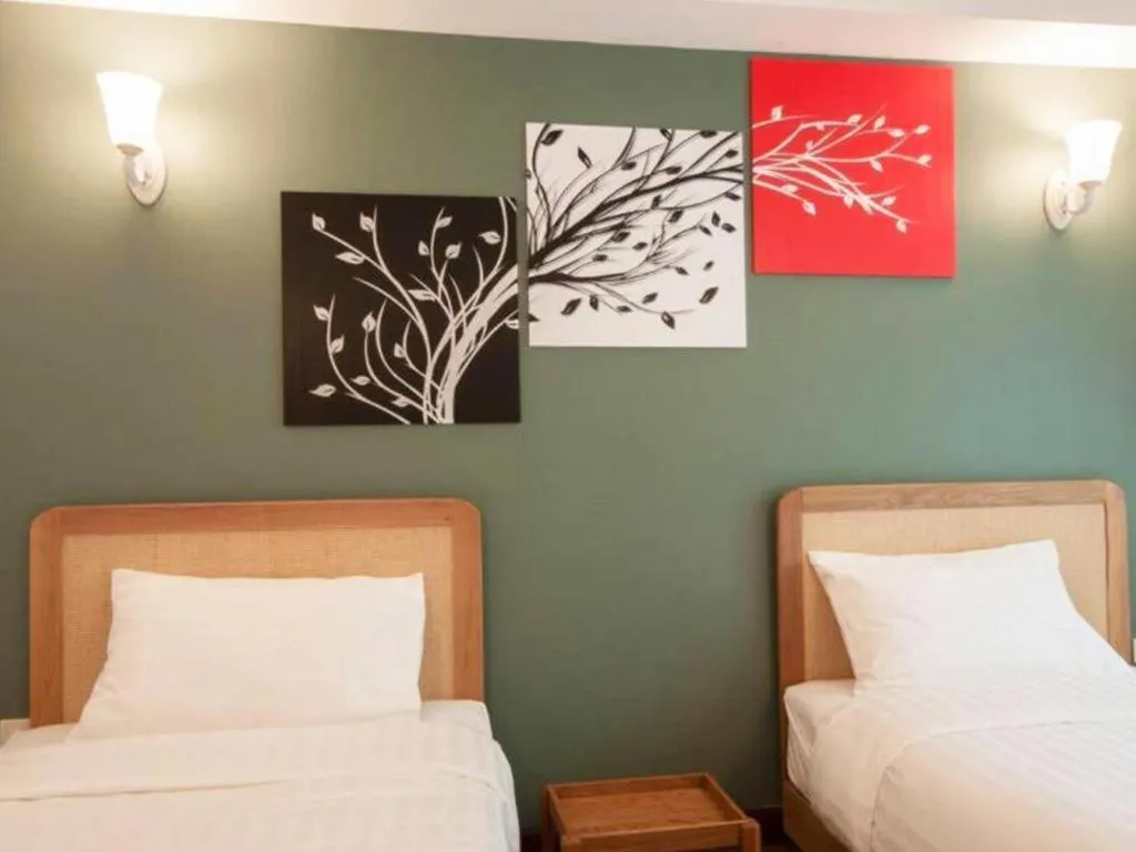 Bed in Cozy At 9 Hotel And Kitchen