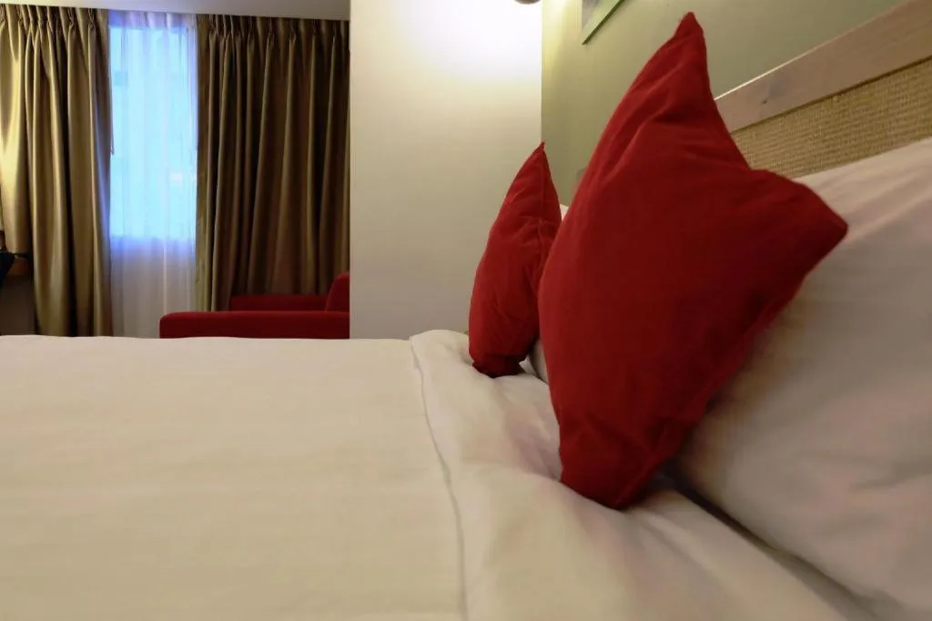 Bed in Cozy At 9 Hotel And Kitchen